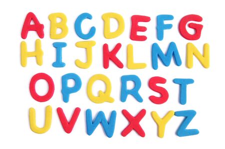 Colored alphabet letters over whiteの写真素材