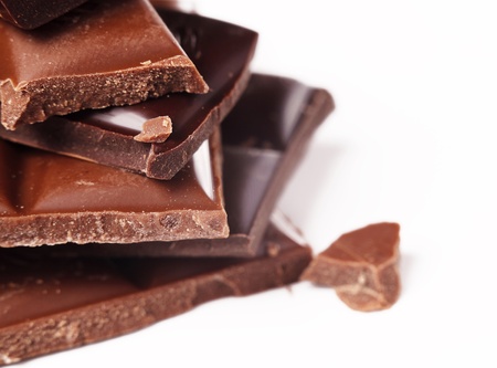 Milk and black chocolate pieces closeup imageの写真素材