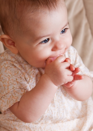 Adorable smiling baby girl closeup portraitの写真素材
