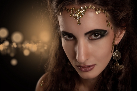 Close-up portrait girl with fashion makeup and snake skinの写真素材