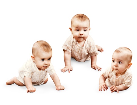Three images crawling little baby girl isolated on whiteの写真素材