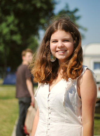 Opened smiling teenage girl outdoor portraitの写真素材