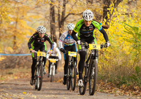 DNIPRODZERZHYNSK, UKRAINE - OCTOBER 26   Members of bicycle race competition passing last kilometers in race dedicated to city Liberation Day on October 26,2013 in Dniprodzerzhynsk, Ukraine のeditorial素材