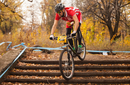DNIPRODZERZHYNSK, UKRAINE - OCTOBER 26   Members of bicycle race competition passing last kilometers in race dedicated to city Liberation Day on October 26,2013 in Dniprodzerzhynsk, Ukraine のeditorial素材