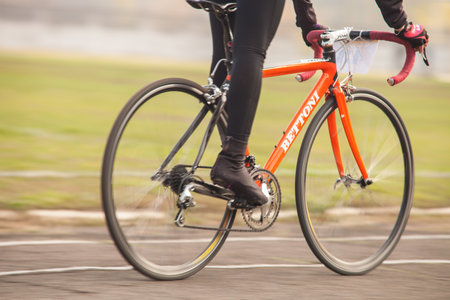 DNIPRODZERZHYNSK, UKRAINE - OCTOBER 26   Members of bicycle race competition passing last kilometers in race dedicated to city Liberation Day on October 26,2013 in Dniprodzerzhynsk, Ukraine のeditorial素材
