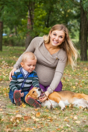 Happy family leisure scene in autumn parkの写真素材