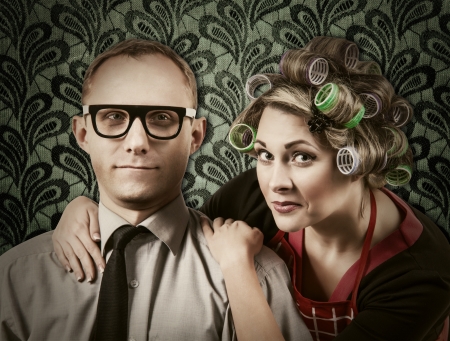 Funny family portrait - henpecked husband with wifeの写真素材