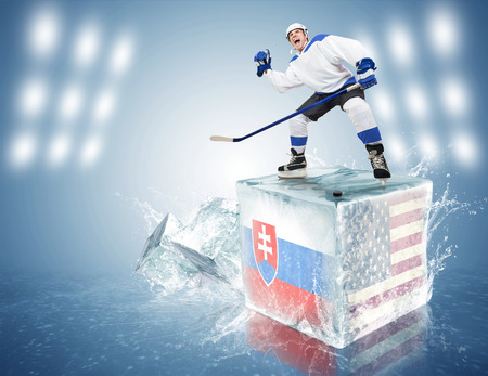 Slovakia - USA game  Spunky hockey player on ice cubeの写真素材