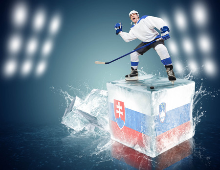 Spunky hockey player on ice cube of Slovakia - Slovenia gameの写真素材
