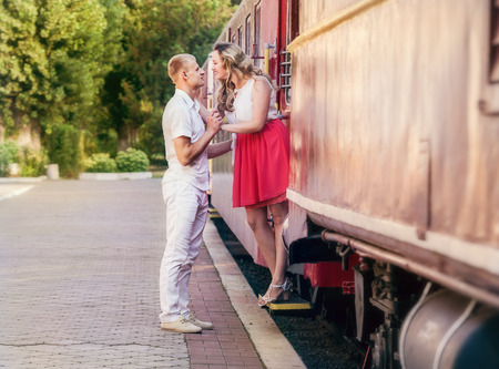 Love couple farewell moment on the retro railway Stationの写真素材