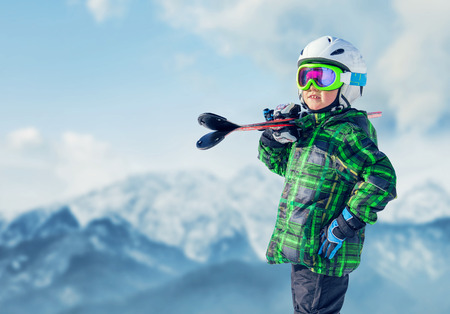 Young skier in mountainの写真素材