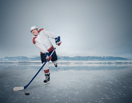 Final gameFinland vs USA. Hockey player on ice cubeの写真素材