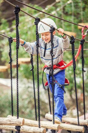 Positive emotion child on the air rope trackの写真素材