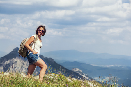 Woman walk on the mountain hillの写真素材
