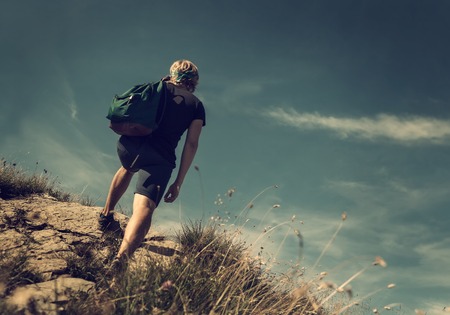 Man climb on mountain hillの写真素材