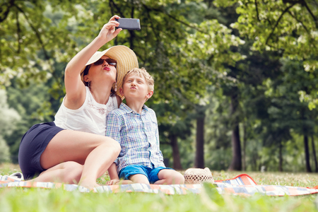 Mother with son take a photo selfieの写真素材