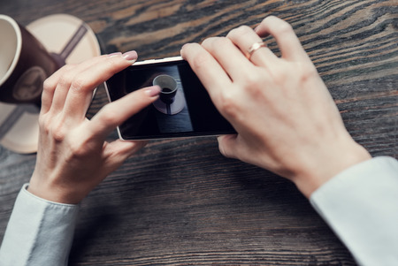 Woman hands with touch screen smartphoneの写真素材
