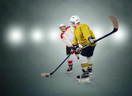 Two ice hockey players during matchの写真素材
