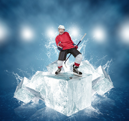 Screaming hockey player on abstract ice cubes backgroundの写真素材