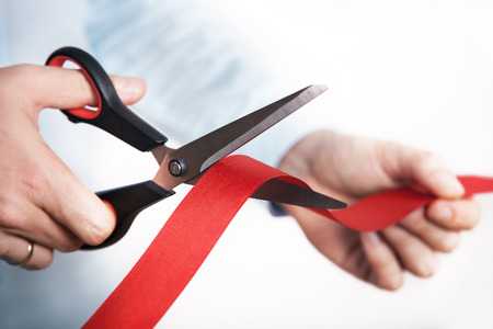 Red ribbon cutting for open new projectの写真素材