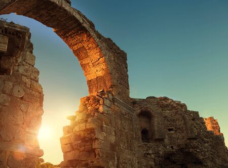 Side archway ruins in sunset timeの写真素材