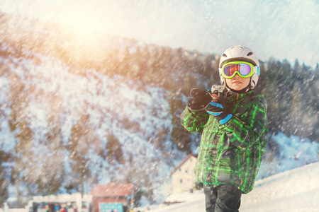 Young skier in full ski equipment in ski arealの写真素材