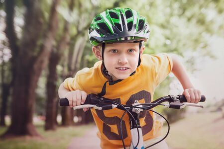Happy little boy ride a bicycleの写真素材