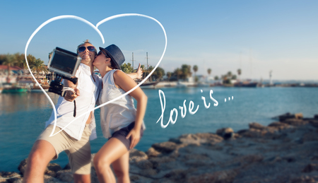 Young couple take their kissing self photoの写真素材