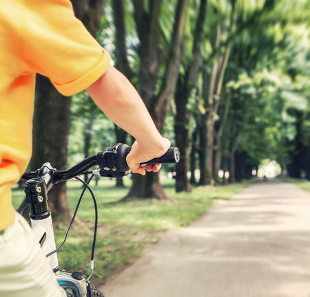 Child hand on the handlebar close up imageの写真素材