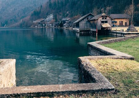 Boats dock on the mountain lake in Hallstatt, Austriaの写真素材