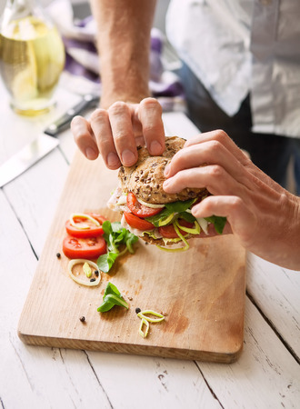 Man take a big sandwich in handsの写真素材