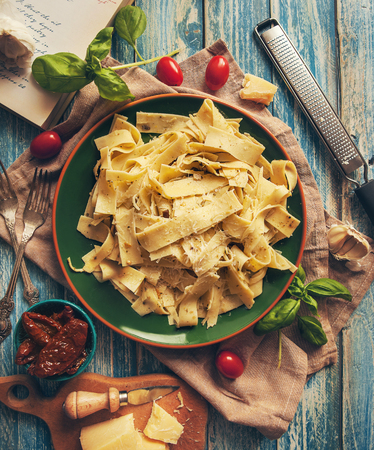 Papardelle italian pasta with fresh cherry tomatoes and basilの写真素材