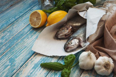 Fresh trouts with lemon and basilicの写真素材