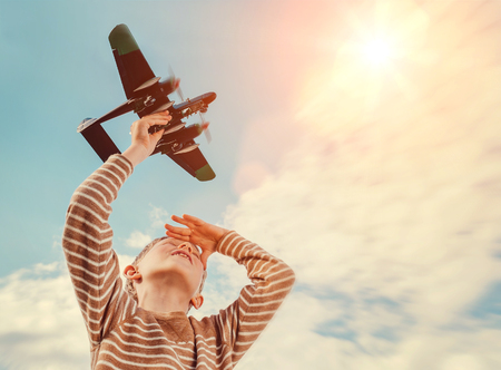 Boy with toy planeの写真素材