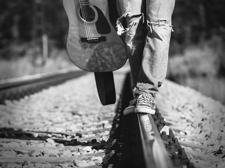 Close up image man legs on the railwayの写真素材