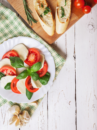 Background with traditional italian caprese saladの写真素材