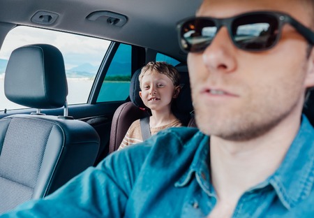 Happy long jorney in car with fatherの写真素材