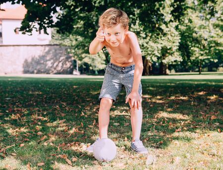 Boy want to kick the ballの写真素材