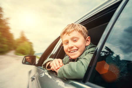 Happy boy travel with father in autoの写真素材