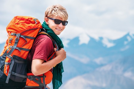 Handsome young man tourist backpacker portrait on Himalaya mountain viewの写真素材