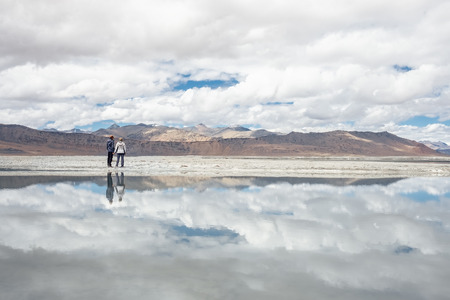 Two travelers stay near the Tso Kar Lake in Himalaya, India, Ladkh region