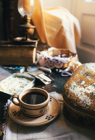 Still life with cup of coffee and vintage sewing accessoriesの写真素材