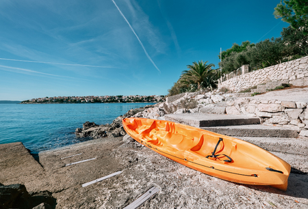 Orange kayak is on the sea pier, Adriatic seaside od Croatiaの写真素材