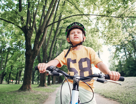 Boy ride his bicycleの写真素材
