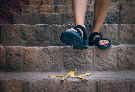 Banana's peel is on the stairs - traveler can steps on itの写真素材