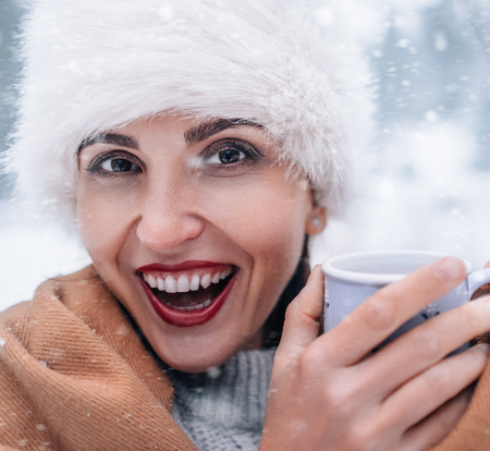 Cheerful woman snow portraitの写真素材