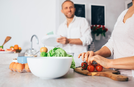 Family moments concept image - married couple prepare meal togetherの写真素材