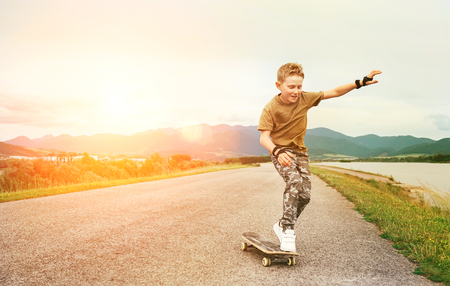 Boy learn to skate on skateboardの写真素材