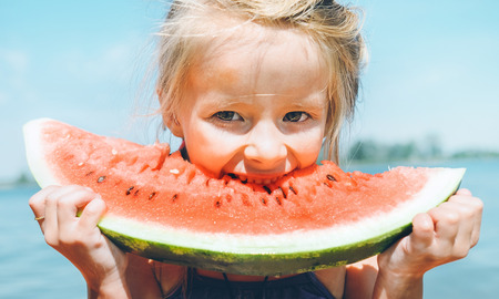 Little girl eat watermelonの写真素材
