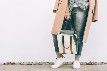 Close up image woman autumn city casual outfit with shopper bagの写真素材